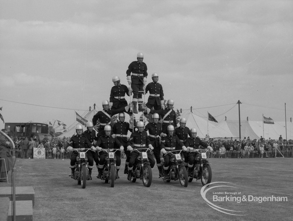 Dagenham Town Show 1967, showing Royal Marines Motorcycle Team Display, with pyramid of marines on five motorbikes in arena, 1967