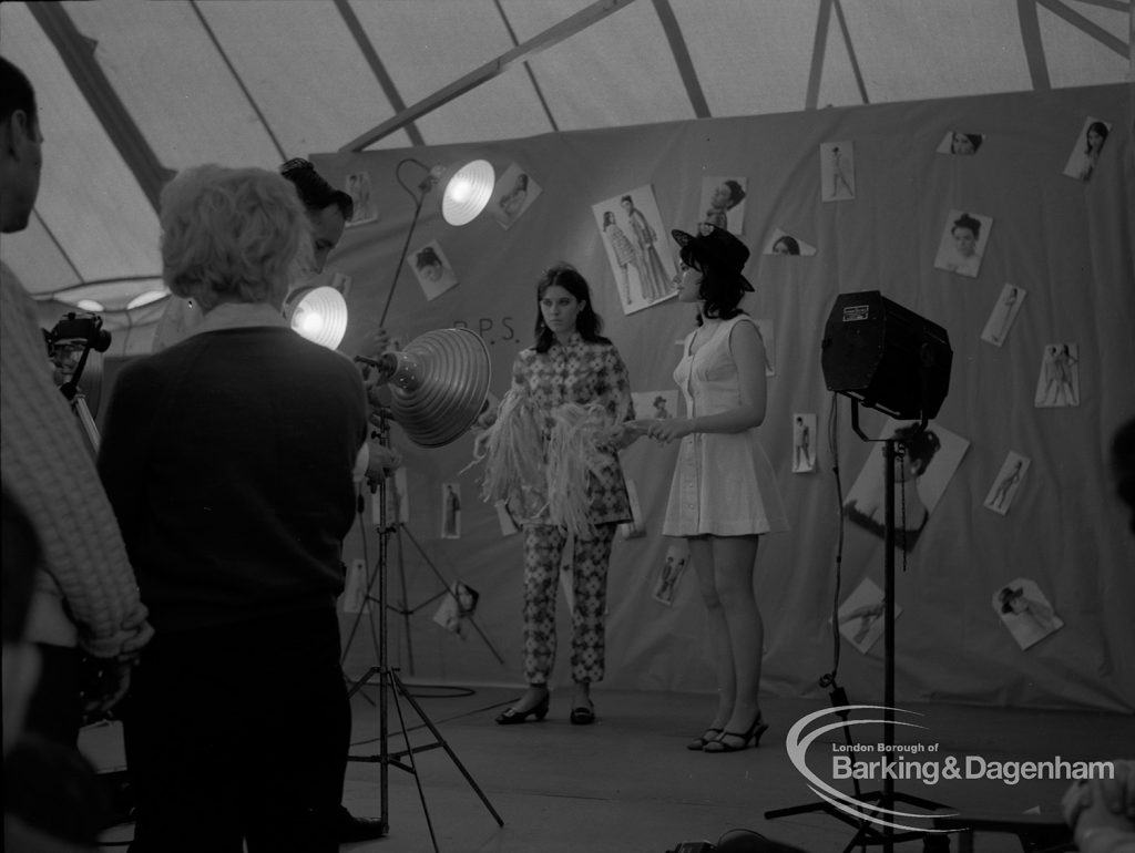 Dagenham Town Show 1967, showing Barking Photographic Society lighted studio, with two female models posing for photographs, 1967