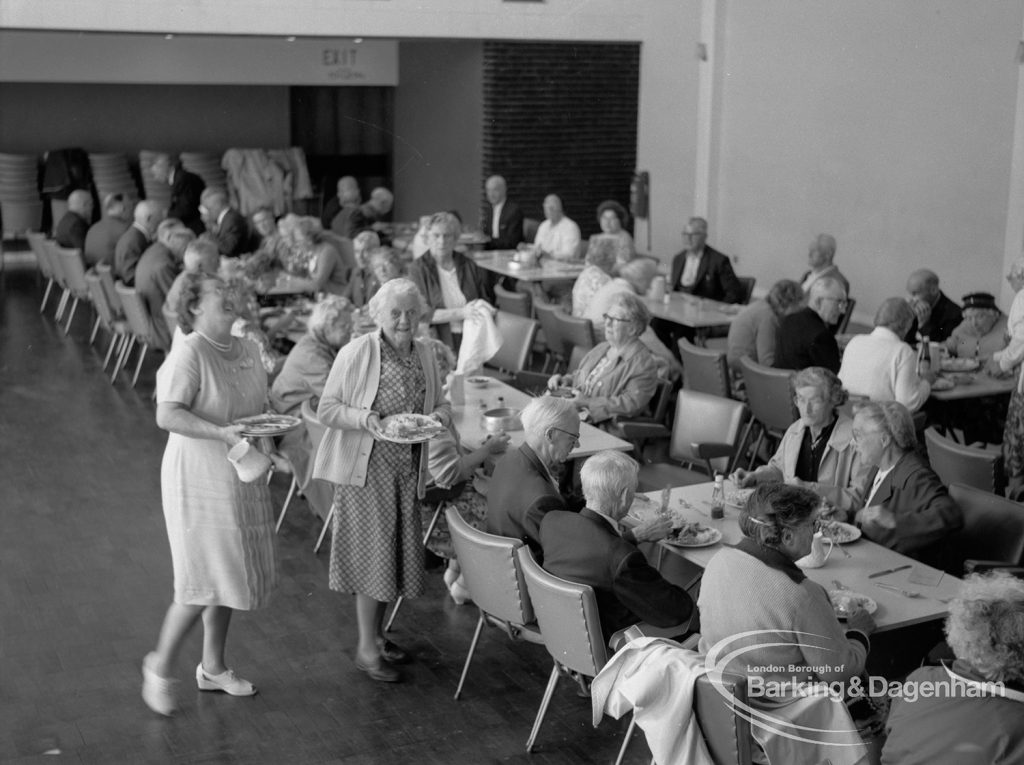 Old People’s Welfare luncheon at Fanshawe Hall, Dagenham, showing servers and guests sitting at tables, looking south-west, 1967