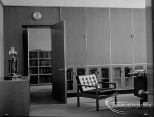 London Borough of Barking Deputy Borough Treasurer’s Office, showing open door revealing bookshelves, tall cupboards, and clock on wall, 1967