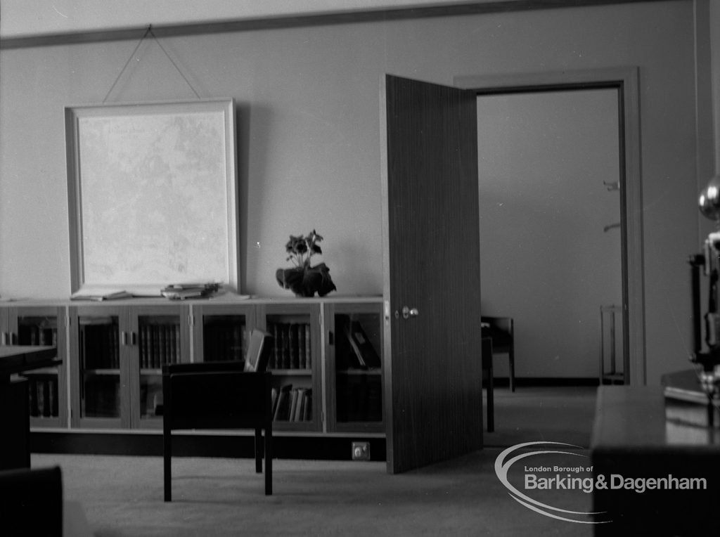 London Borough of Barking Deputy Borough Treasurer’s Office, showing open door, low bookcases and table, 1967