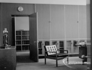 London Borough of Barking Deputy Borough Treasurer’s Office, showing open door revealing bookshelves, tall cupboards, and clock on wall, 1967