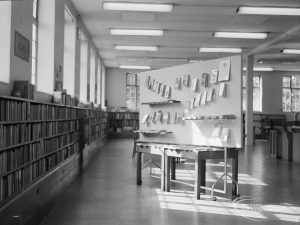 Rectory Library, Dagenham, showing Adult Library looking along south windows towards west, and with display stand, 1967