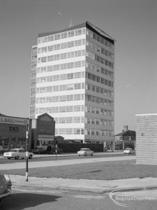Exterior of Asta House, High Road, Chadwell Heath, with lawn in foreground and section of Annie Prendergast Clinic, Ashton Gardens at right, 1967