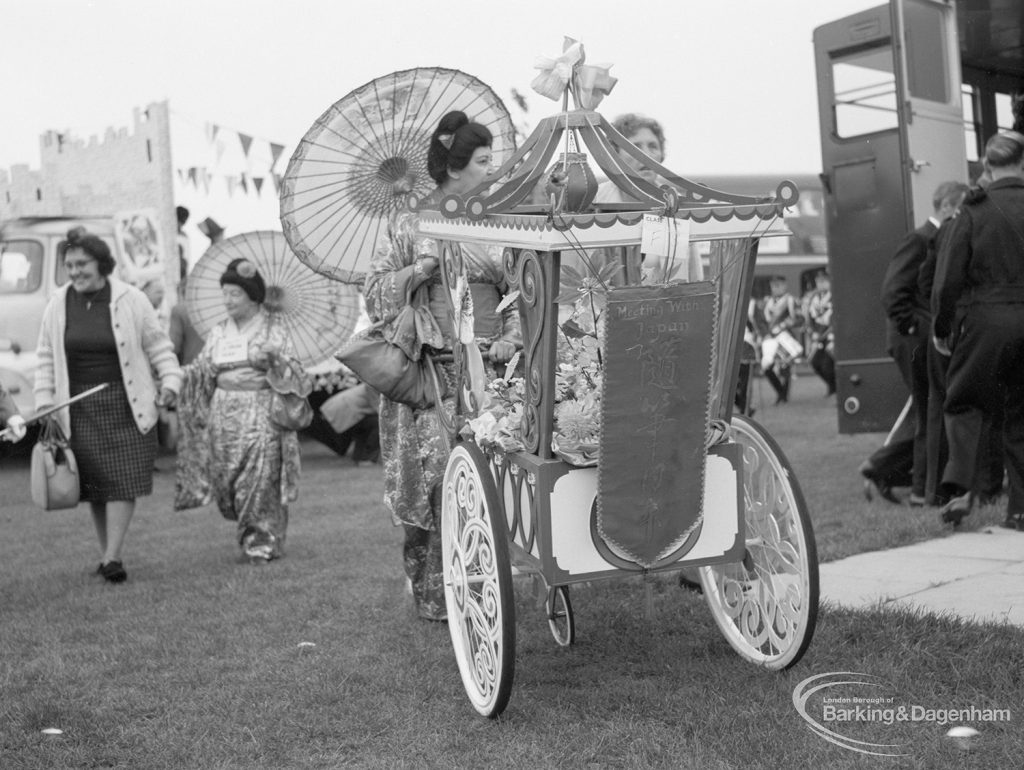 Barking Carnival 1967, showing people with decorated two-wheeled rickshaws and oriental sunshades, 1967