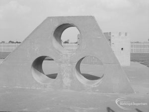 London Borough of Barking Works Department children’s playground in Oval Road North, Dagenham, showing truncated pyramidal climbing equipment pierced by three round holes, 1967