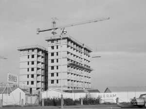 Housing development, showing unnamed twin-tower blocks, ‘Jerram’ site and crane at Becontree Heath [adjoining EES12503], 1967