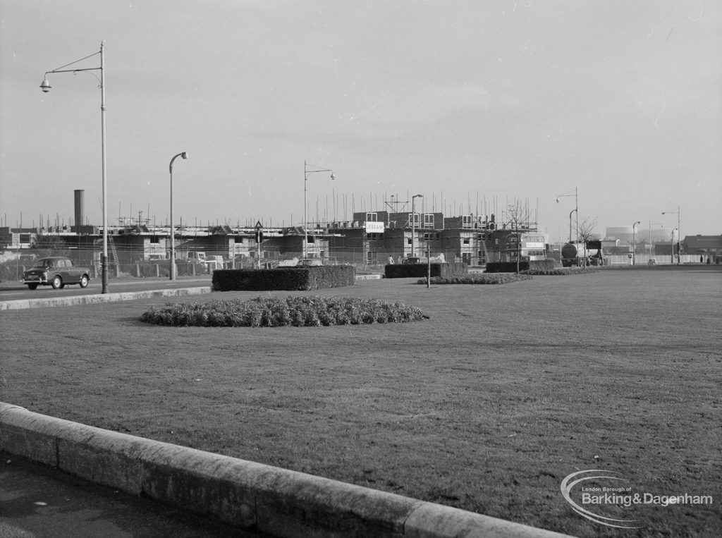 Housing development, showing west tip of the grassed roundabout at Becontree Heath, looking east-south-east, 1967
