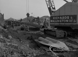 Sewage Works Reconstruction (Riverside Treatment Works) XX, showing ‘Richards and Wallington’ machinery hoisting welded pipeline at Barking Creek outfall, 1967