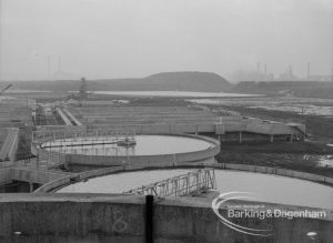 Sewage Works Reconstruction (Riverside Treatment Works) XX, showing  tanks and hill from south [west of EES12591 and adjoining EES12593], 1967