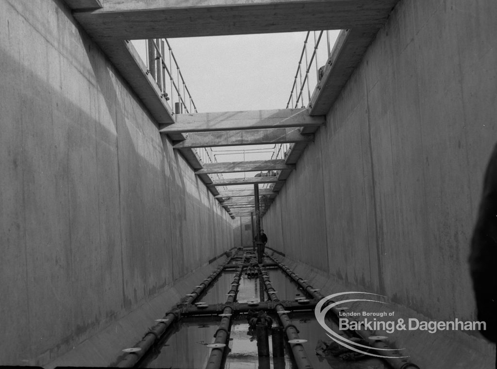 Sewage Works Reconstruction (Riverside Treatment Works) XX, showing high walls of empty tanks, 1967