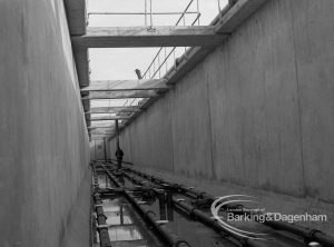 Sewage Works Reconstruction (Riverside Treatment Works) XX, showing high walls of empty tanks, 1967