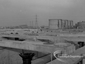 Sewage Works Reconstruction (Riverside Treatment Works) XX, showing view of cross concrete beams and distant tanks, 1967