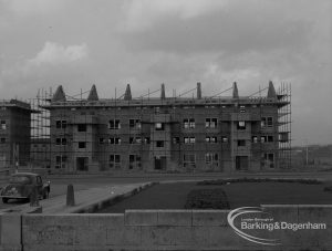 Housing development with three-storey ‘porches’ on north side under construction at Becontree Heath, taken from across north Civic Centre garden, 1968