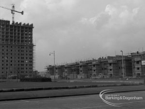 Housing development under construction at Becontree Heath, showing housing on north approach across roundabout in Stour Road area, including part of twin block of flats, 1968