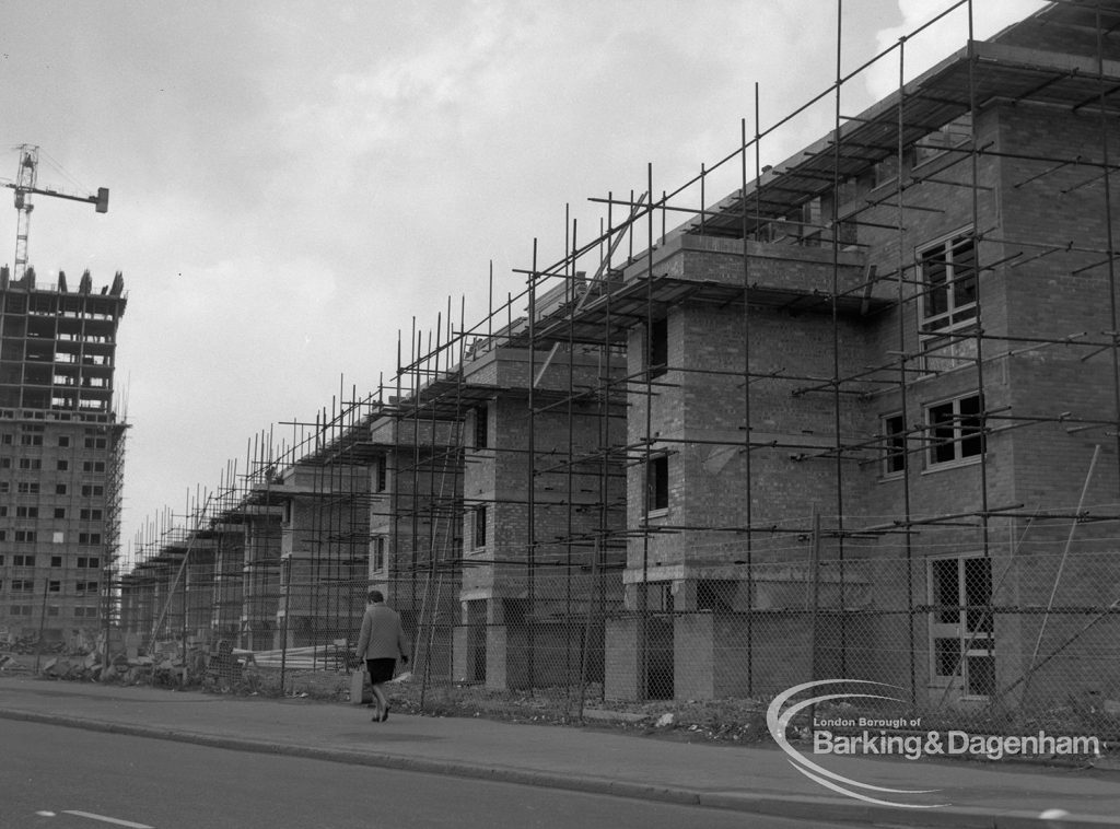 Housing development in Wood Lane with three-storey ‘porches’ on north side, under construction at Becontree Heath and taken from east, 1968