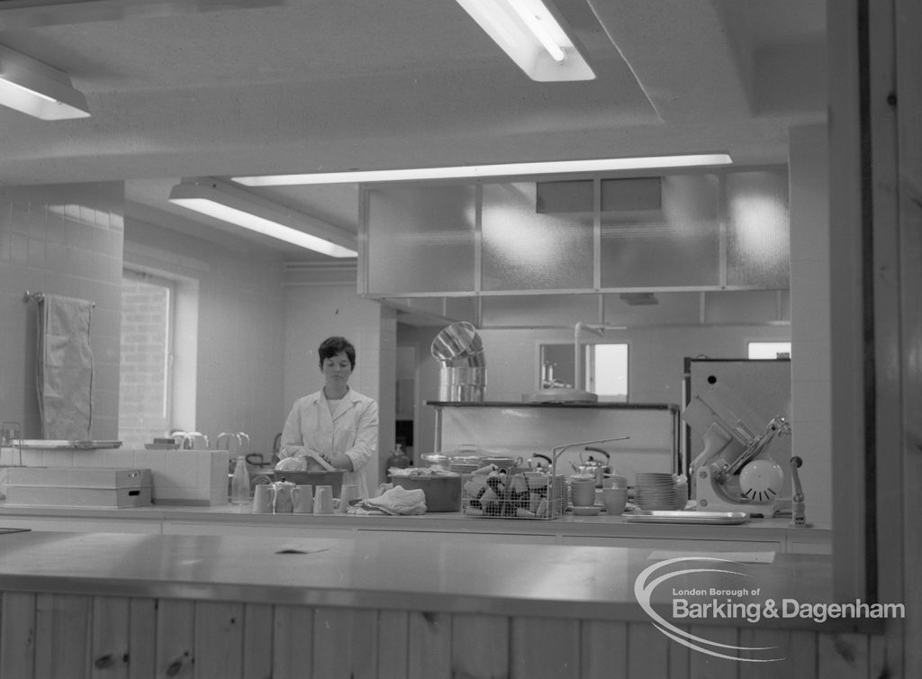 New Riverside Old People’s Home for Senior Citizens, Thames View, showing view into kitchen with a member of staff, 1968