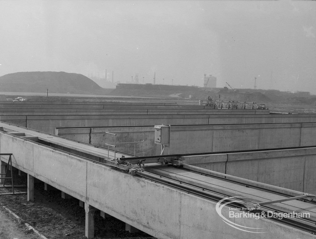 Sewage Works Reconstruction (Riverside Rainham Works), showing storm tanks with embankment beyond [see also EES12770], 1968