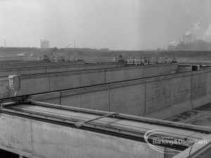 Sewage Works Reconstruction (Riverside Rainham Works), showing storm tanks with embankment beyond [closer view of EES12769], 1968