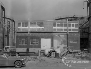 Sewage Works Reconstruction (Riverside Rainham Works), showing front of new building with digesters on left, 1968