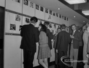 Arts Council, showing celebrations at one hundredth performance of Fanshawe Film Society, with visitors examining stills on walls of vestibule, 1968