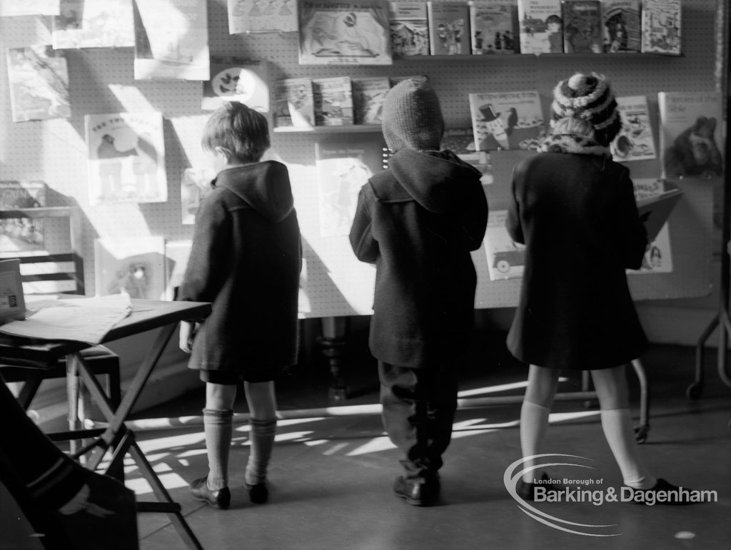 Barking Libraries Children’s Book Week [18th to 27th March] at Valence House, Dagenham, showing three children examining books, 1968