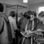 Barking Libraries Children’s Book Week [18th to 27th March] at Valence House, Dagenham, showing group of people looking at books and exhibition, 1968