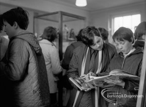 Barking Libraries Children’s Book Week [18th to 27th March] at Valence House, Dagenham, showing group of people looking at books and exhibition, 1968