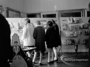 Barking Libraries Children’s Book Week [18th to 27th March] at Valence House, Dagenham, showing group of people looking at ‘Publications of month’ display, 1968