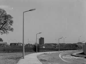 Street lighting, showing three columns overhanging Church Lane, Dagenham [Ballards Road end] and heap of debris, 1968