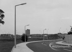Street lighting, showing three columns on curve of Church Lane, Dagenham after pavement swept clean, 1968