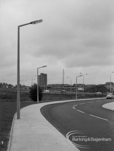 Street lighting, showing three columns on curve of Church Lane, Dagenham after pavement swept clean, 1968