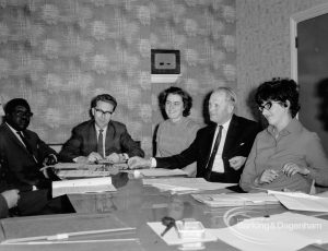 Child Welfare at Woodstock Hall, Gubbins Lane, Harold Wood, showing psychiatrists, headmaster and welfare officers discussing case, 1968