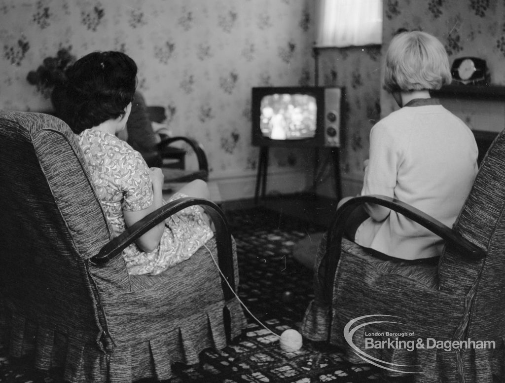 London Borough of Barking Child Welfare hostel at 144 Longbridge Road, Barking, showing girls knitting and watching television, 1968