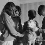 Child Welfare, showing children with dog named Rusty [possibly in house at 100 Balgores Lane, Gidea Park], 1968