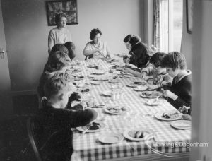 Child Welfare, showing children at tea [possibly in house at 100 Balgores Lane, Gidea Park], 1968