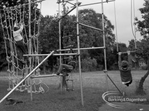 Child Welfare at Woodstock Hall House, Harold Wood, showing children on climbing apparatus, with two boys climbing rope ladders, 1968