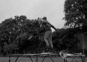 Child Welfare at Woodstock Hall House, Harold Wood, showing boy on trampoline, 1968