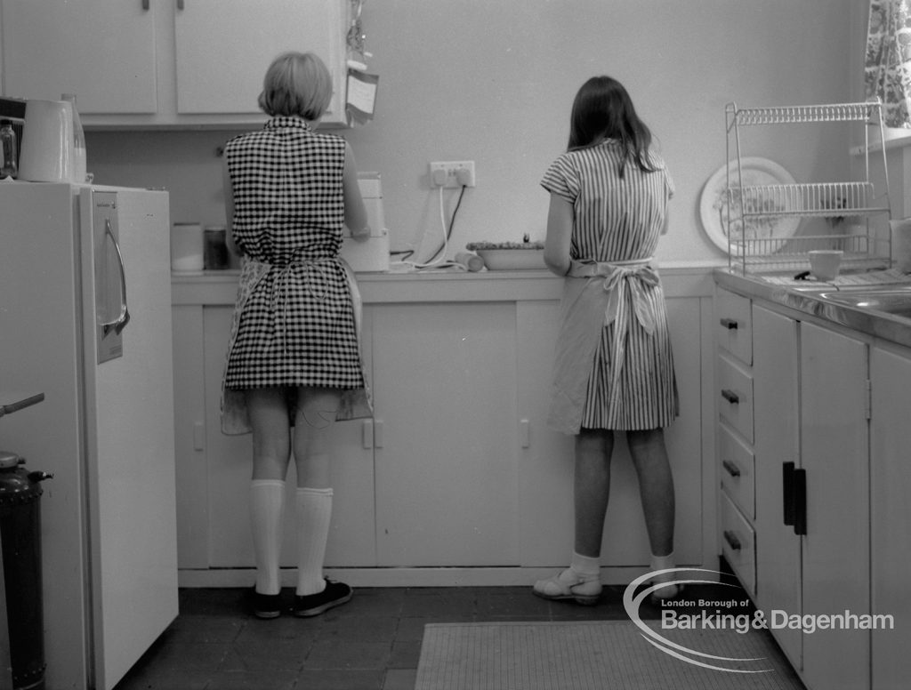 Child Welfare at Tudor House, 212 Becontree Avenue, Dagenham, showing kitchen and two girls, 1968