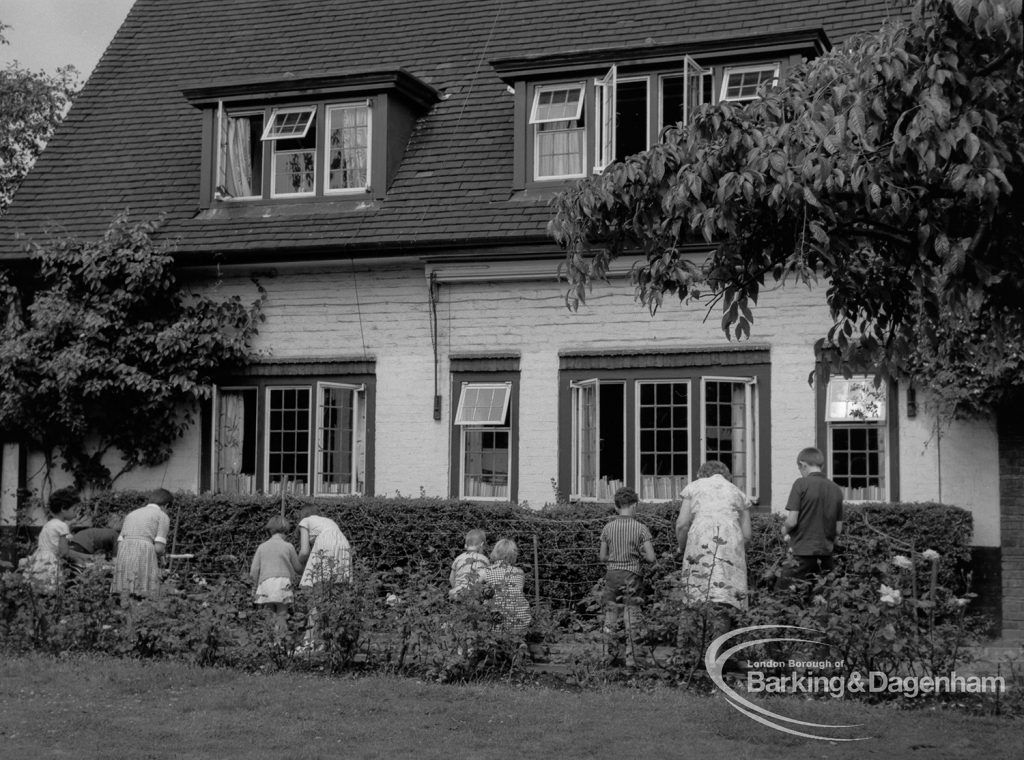 Child Welfare at Tudor House, 212 Becontree Avenue, Dagenham, showing house from the garden, with nine residents, 1968