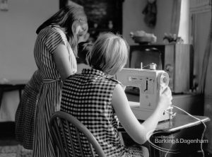 Child Welfare at Tudor House, 212 Becontree Avenue, Dagenham, showing two girls at sewing machine, 1968