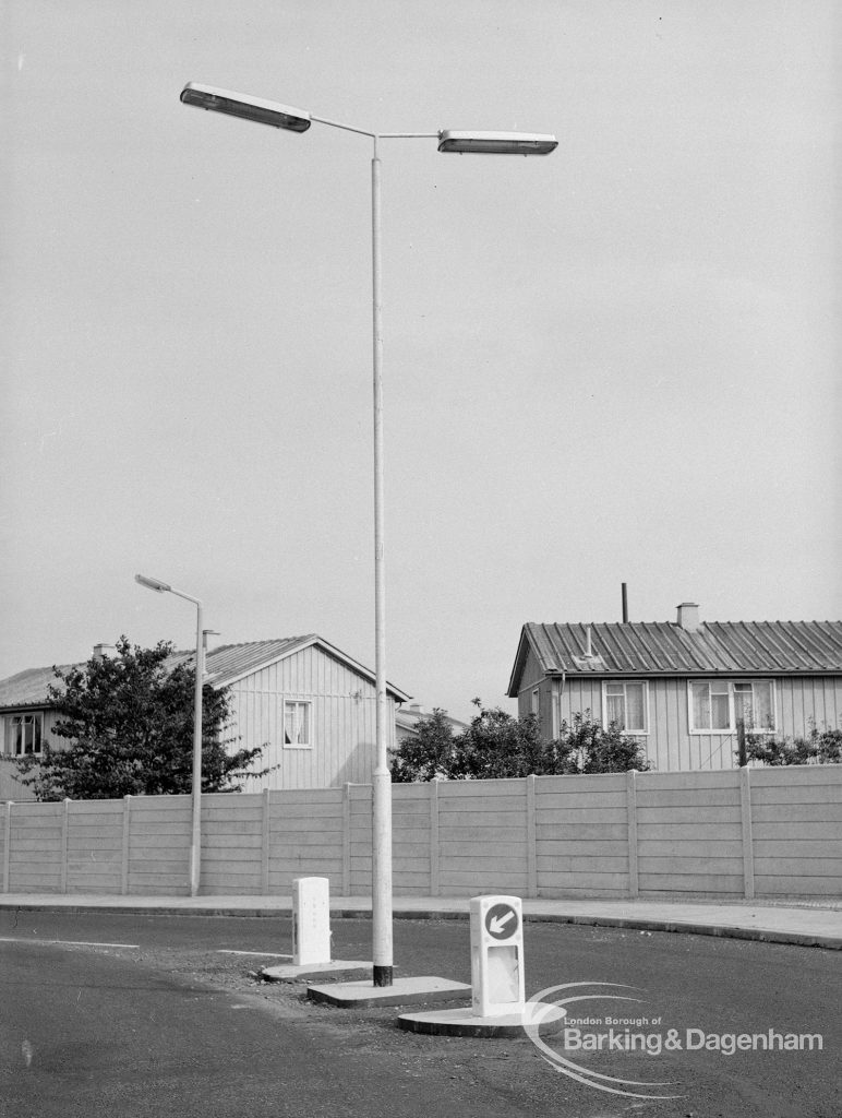 Individual aluminium lighting columns in Siviter Way area, Dagenham, showing single T-headed column above illuminated bollards in Farm Close, 1968