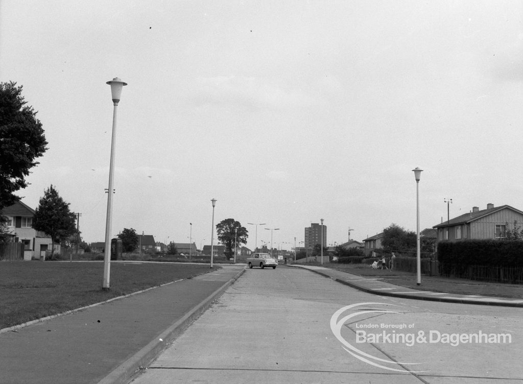 View from Mr and Mrs Whithead’s flat at 92 Thaxted House, Siviter Way, Dagenham, showing street lighting in Church Lane and Ballards Road roundabout area and beyond, 1968