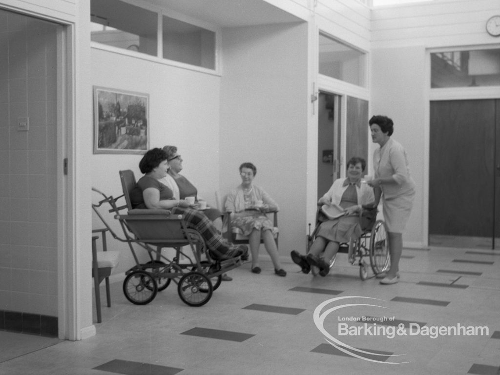 Welfare, showing Leys Avenue Occupational Centre for the Physically Handicapped, Dagenham, with patients seated in main hall and member of staff, 1968