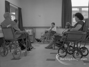 Welfare, showing Leys Avenue Occupational Centre for the Physically Handicapped, Dagenham, with wheelchair users in the television room, 1968