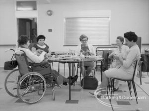 Welfare, showing Leys Avenue Occupational Centre for the Physically Handicapped, Dagenham, with patients making baskets at table, 1968