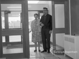 Welfare, showing Leys Avenue Occupational Centre for the Physically Handicapped, Dagenham, with patient entering the Centre with a member of staff, 1968