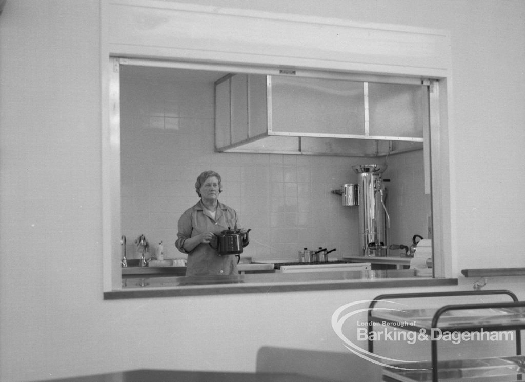 Welfare, showing Leys Avenue Occupational Centre for the Physically Handicapped, Dagenham, with serving hatch in the canteen and a member of staff holding teapot, 1968