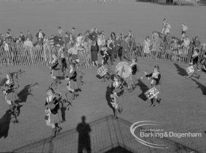 Barking Carnival 1968, showing Dagenham Girl Pipers passing dais, 1968