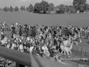 Barking Carnival 1968, showing concourse with visitors, marching band, and raffle drum, 1968